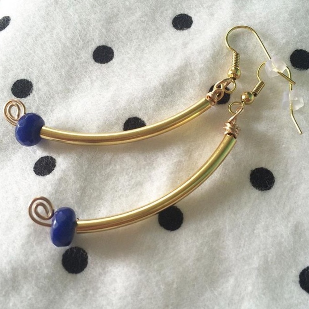 Simple gold earrings with a splash of blue